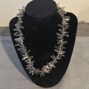 Non adjustable 18” necklace . Clear with hints of brown .